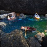 Miniaturfiguren in Booten