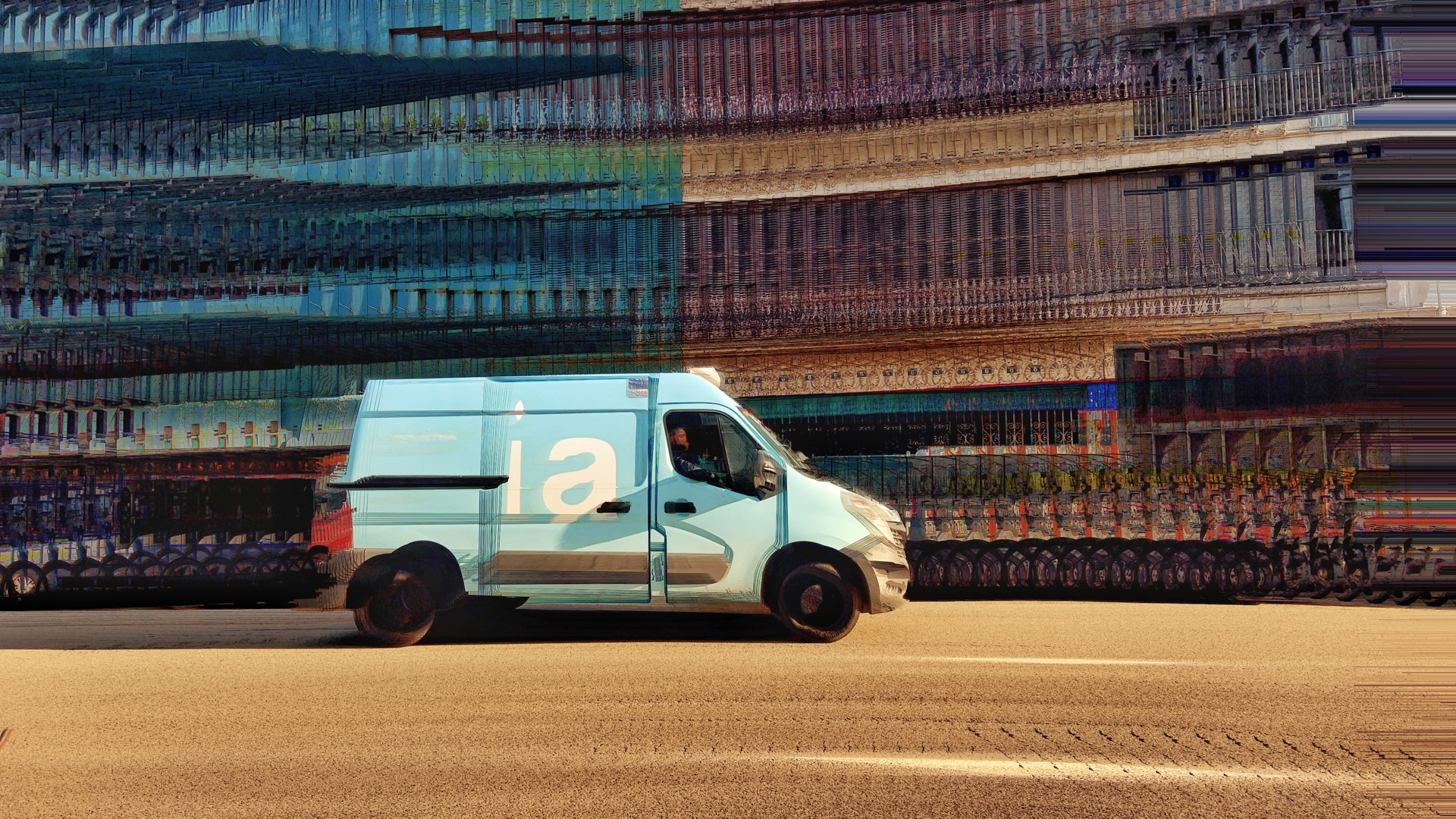 Blauer Lieferwagen fährt seitlich vorbei, der Hintergrund ist durch Einsatz der App Bluristic verwischt und unscharf